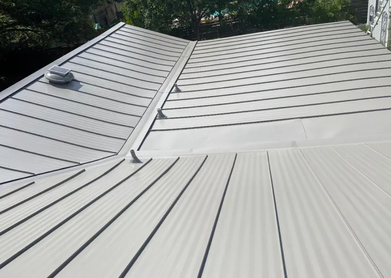 Solar attic fan installed on a metal roof for Roof Ventilation in Rainbow Springs